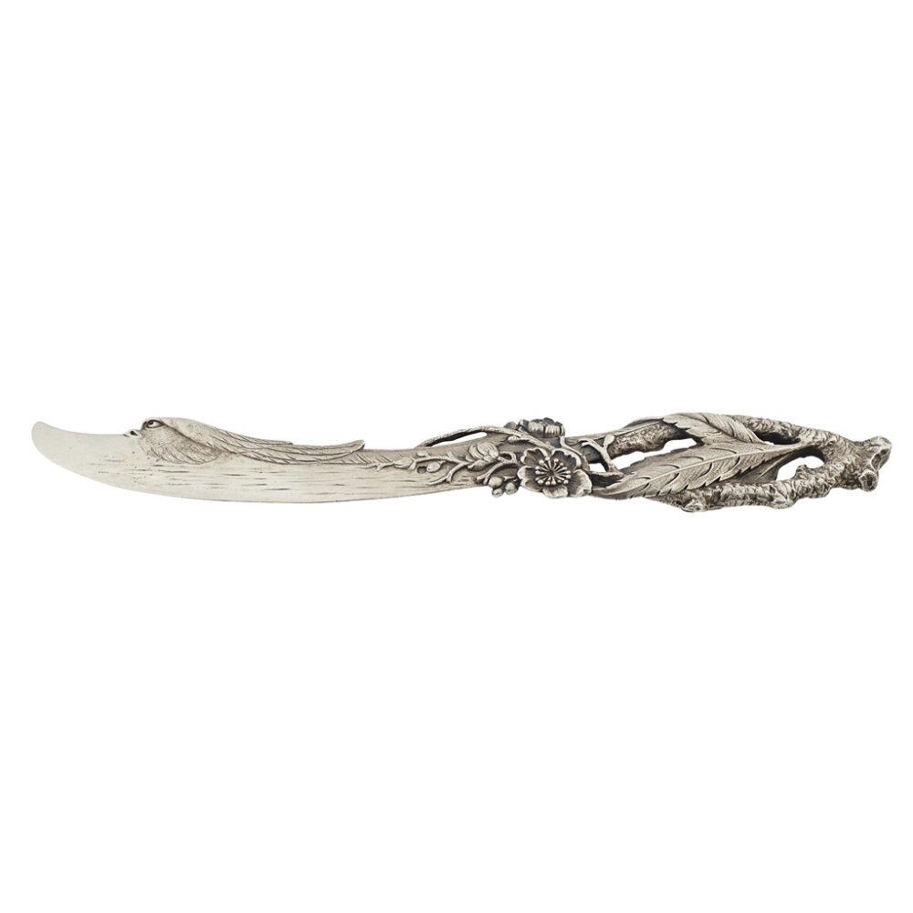 A French cast silver paper knife indistinctly marked, the blade formed as a stylised bird's head,