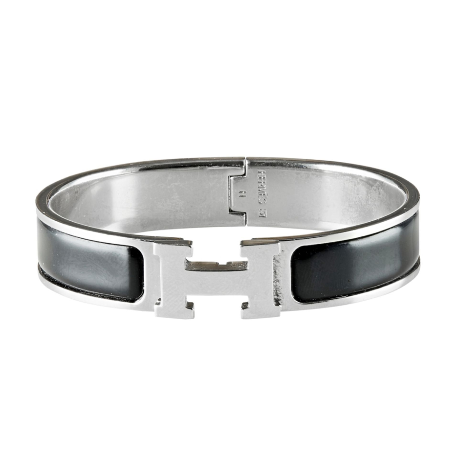 A 'Clic H Bracelet', Hermes of hinged design, with black enamel ground, H detail clasp, stamped