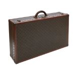 A Louis Vuitton brass bound early 20th century suitcase of rectangular form, the corners with