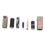 A group of silver and enamel lipstick holders, scent bottle, lighter and propelling pencil a