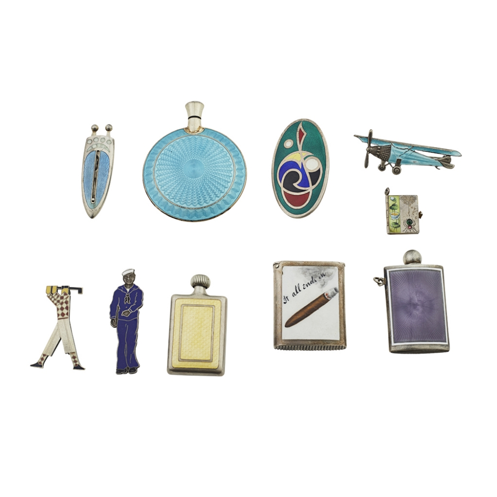 A group of silver and enamel brooches and scent bottles to include; a cigar cutter, unmarked of