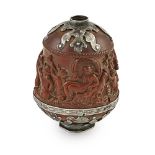 A silver-mounted coquilla nut powder flask, the mounts 17th century of tapering ovoid form, the