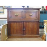 An Edwardian walnut secretaire, the partially hinged top and front revealing a sliding fitted