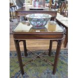 A George III style mahogany occasional table, the canted rectangular top over pierced brackets and