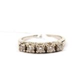 A five stone diamond ring set in white metal (shank broken)