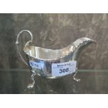 A silver gravy boat on three pad feet, Sheffield 1929