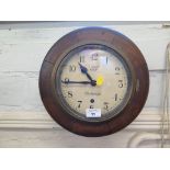 An oak framed circular Smiths Astral wall clock, inscribed J. Smith Clerkenwell, single train