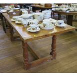 A pine refectory table, the rectangular top on turned legs joined by a H-stretcher 182cm x 75cm