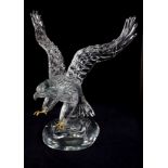 An Italian glass figure of a Bald Eagle, with gilded metal claws, the base with etched Pino