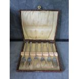 A cased set of six E.P. cake forks