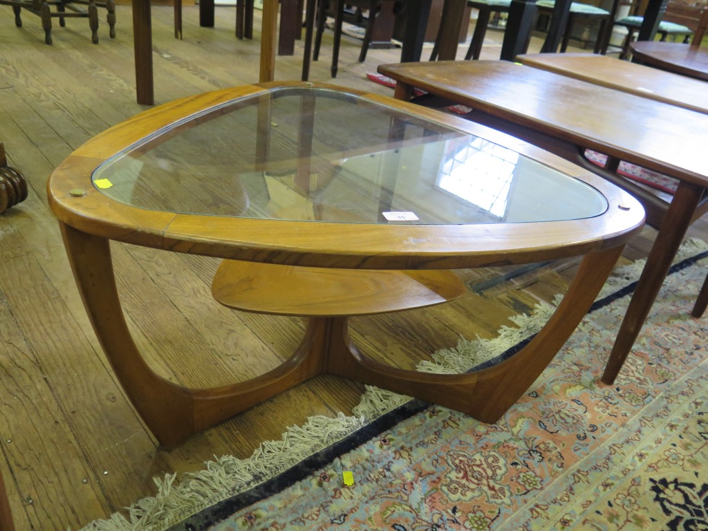 Vintage teak framed coffee table, triangular shape with glass top and teak shelf below