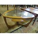 Vintage teak framed coffee table, triangular shape with glass top and teak shelf below