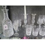 A Waterford crystal decanter and stopper, 34cm high, a pair of Waterford candlesticks, a pair of