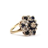 A large sapphire and diamond cluster ring set in 9 carat gold