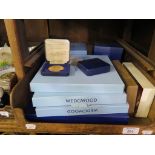Various Royal Commemorative wares, including boxed Wedgwood plates and mugs, Royal Mint coins,