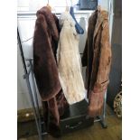 A Brown fur coat, 100cm long and two faux fur coats (3)