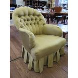 A button upholstered armchair, on square oak legs and castors, 1950s
