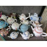 A collection of Victoria and Albert Museum collectors teapots and other reproduction teapots, and