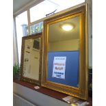 A giltwood framed rectangular wall mirror 94cm x 63cm and another with bevelled plate 76cm x 53cm (