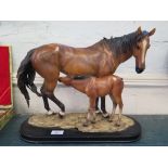 A model of a mare and foal, on a plinth base, 35cm high