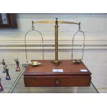 A mahogany and brass scientific balance stamped Oertling, London, 25cm wide