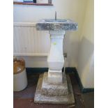 A composite square baluster garden sundial 82cm high