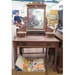 An Edwardian dressing table, with swing mirror, trinket drawers, frieze drawers and turned legs,