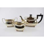 A three piece silver tea set with beaded edge all on ball feet, Chester 1930