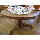 A William IV mahogany snaptop breakfast table, the circular top on an octagonal stem and