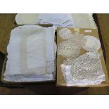 A collection of lace and linen place mats and other tablewares, some French and Victorian