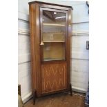 A 1960's rosewood corner display cabinet, the glazed door over an inlaid cupboard door, on moulded