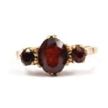 A three stone garnet ring set in 9 carat gold