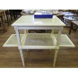 A French painted wood and wicker side table with undershelf and opening ends, 77cm high x 60cm wide