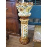 A Burmantofts Faience sunflower pattern jardiniere on stand, with relief mounted decoration, stamped