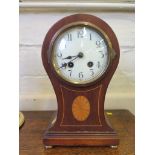 A mahogany and patera inlaid waisted mantel clock, with enamel dial, brass pad feet and twin train