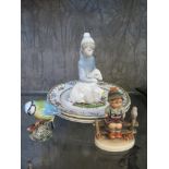 A Beswick figure of a bluetit 17cm high, a W. Goebel Hummel figure of a boy on a fence, a Lladro