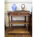 A late Victorian oak whatnot, with three tiers, the top with two frieze drawers on turned supports