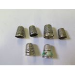 Six silver thimbles