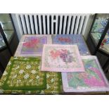 Four printed silk Thai cushion covers 41cm square, and a Syrian embroidered table cloth with eight