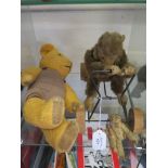 A Schucco toy figure of a monkey on a quadcycle, another miniature monkey and a teddy bear (3)