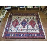 A flat weave rug, the three medallions on a cream field decorated with animals in a similar border