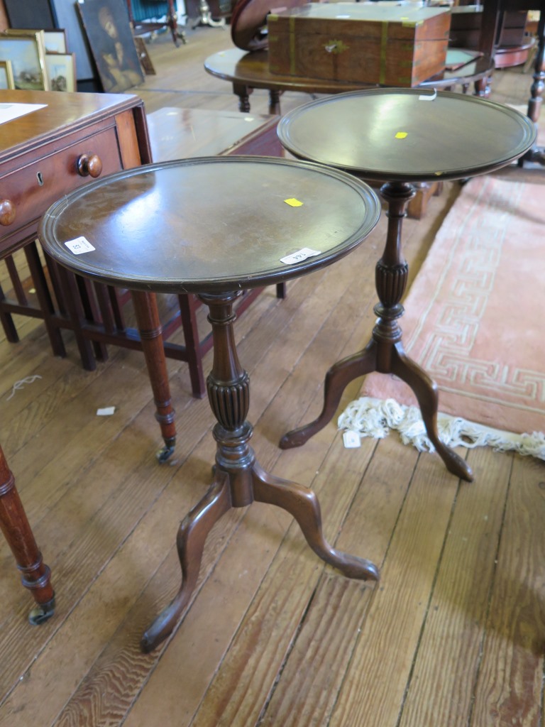 Two reproduction mahogany tripod tables, with reeded baluster supports, 38cm diameter