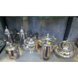 A pair of silver plated coffee pots, tea pots, etc