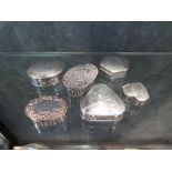 A collection of six silver pill boxes