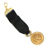 A coin fob with two gold coins