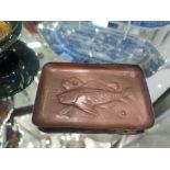 A copper pin tray, rectangular, with relief fish motif, stamped Newlyn 12.2cm x 8cm