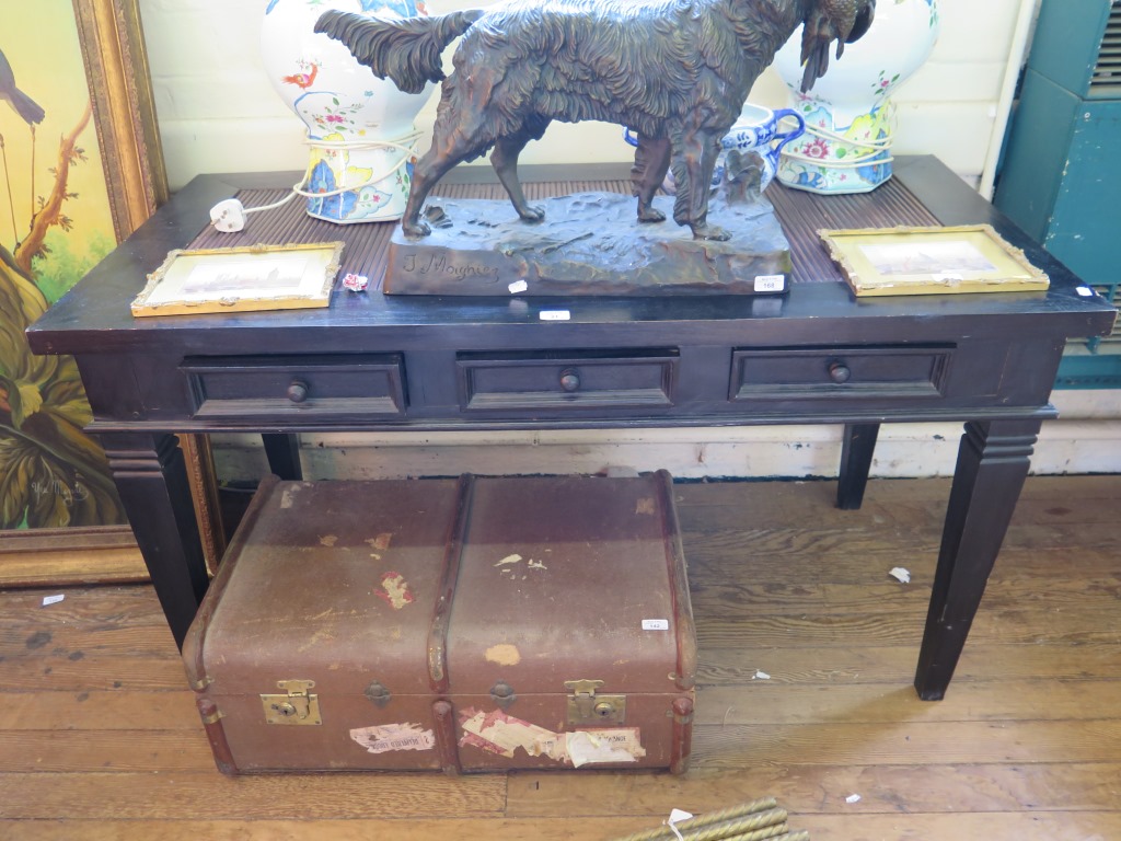 An ebonised side table with rush inset top over three drawers on square tapering legs 140.5cm wide