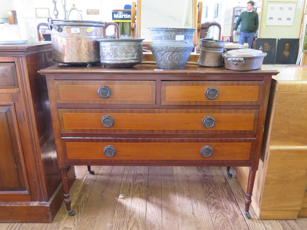 A mahogany and satinwood dressing table base, with two short and two long drawers on turned legs and