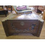 A Chinese carved camphorwood chest with stepped lid, 94cm wide, 48cm deep, 51cm high