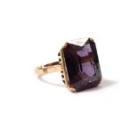 A 14 carat large purple stone ring